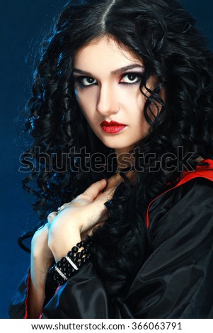 beautiful young woman with artistic vampire style make up