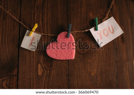 Declaration of love on a wooden background.
