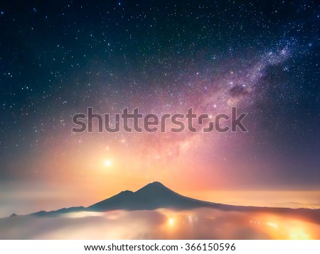 This photo was captured on Bali (Indonesia) just before the sunrise from the peak of Mt. Batur (1,717 m) with a view of Abang (2,151 m). To the left from it is a dazzling Venus.
