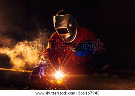 Industrial Worker at the factory welding closeup Royalty-Free Stock Photo #366167945