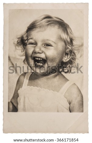 Happy Laughing Little Baby Girl. Vintage picture with original film grain and blur