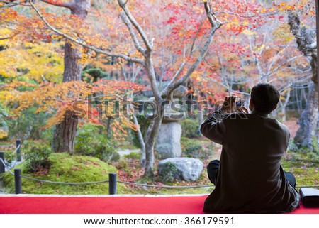 man admire the view autumn leaves