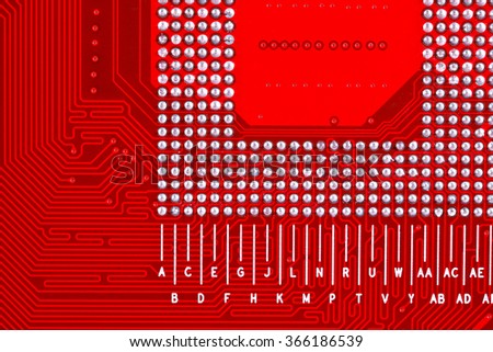 Red circuit board texture background close-up of computer motherboard
