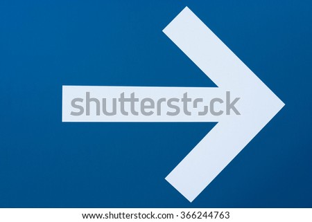 white arrow on blue background
