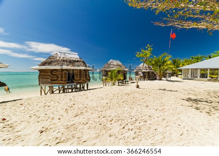 Bungaolow on sunny beach at Samoa island in south pacific Royalty-Free Stock Photo #366246554