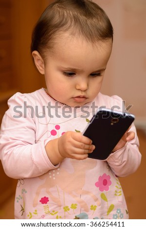 Modern baby with a mobile phone