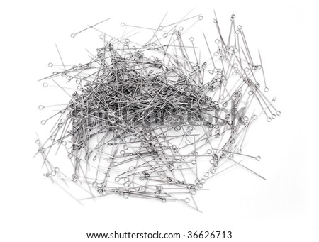 sewing needle on a white background scattered with a lot of eye pins