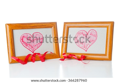 Drawn hearts  in the photo frames on white background