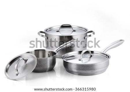 Stainless steel pots and pans isolated on white background Royalty-Free Stock Photo #366315980