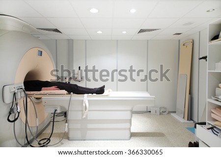 CT (computer tomography) scanner with male patient in hospital 