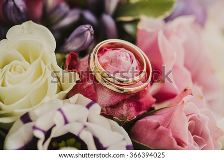 Flowers with wedding rings