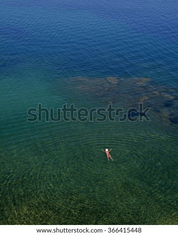 a man in the azure sea, Corfu, Greece
