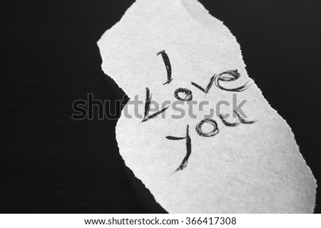 Ripped piece of paper with a handwritten love note