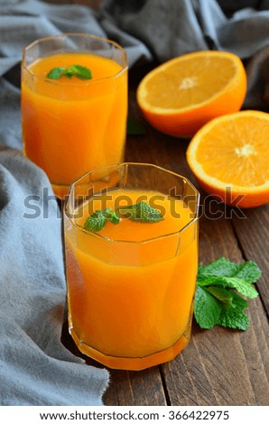 Pumpkin Orange Drink on wooden background