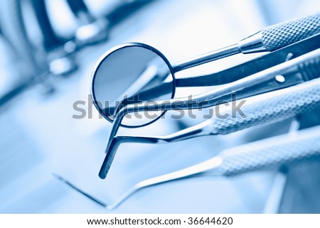 dentist's instruments with shallow depth of field blue tinted Royalty-Free Stock Photo #36644620
