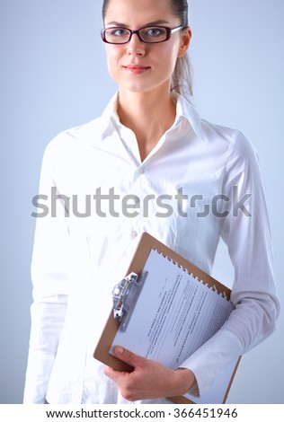 Portrait of a business woman holding folder 