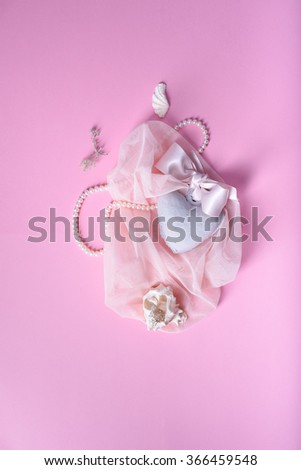 Valentineâ??s day, wedding, save the date romantic card or invitation. Heart, shells, veil, silk ribbon over pink background.  Top view.