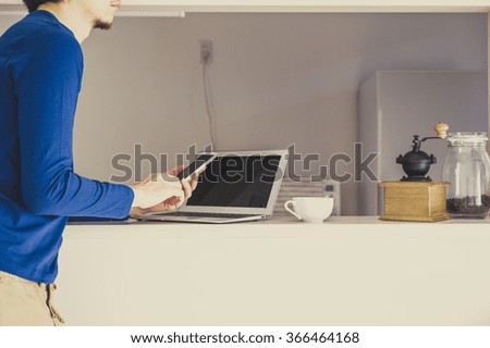 Counter kitchen, men and smart phone