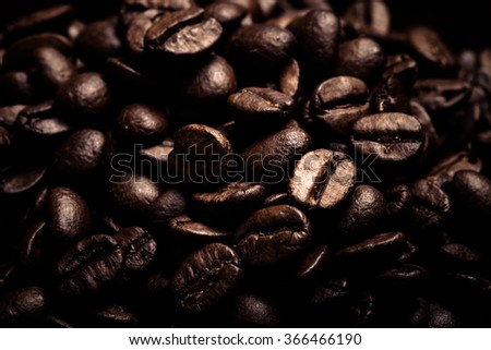 Different kinds of coffee on wooden plate. Selective focus. Toned.