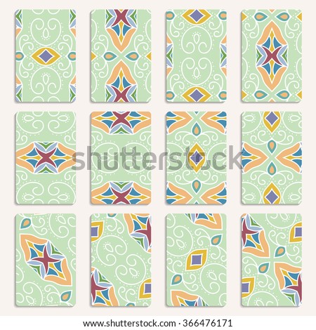 multicolored set of twelve business card templates with hand drawn tribal ornament, mandala, for greeting, invitation card, or cover. Vector illustration