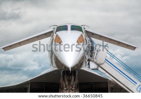 supersonic jet plane on the ground boarding with blue sky in background