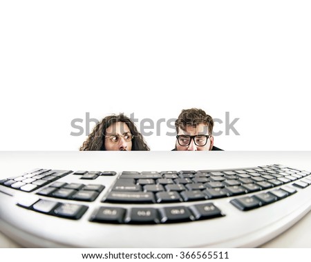 Two nerds starring at keyboard