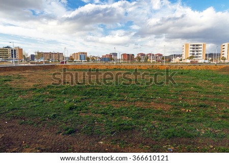 Vacant lots for a Housing Estate under Construction - Cityscape estate or housing development, with empty lots to build  Royalty-Free Stock Photo #366610121