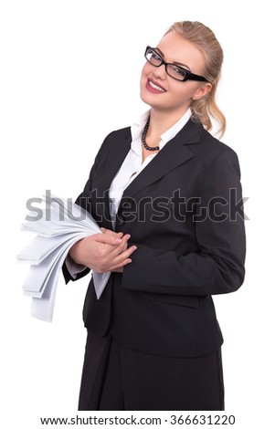 Happy assistant with suits holding papers and smiling at camera - Stock Image