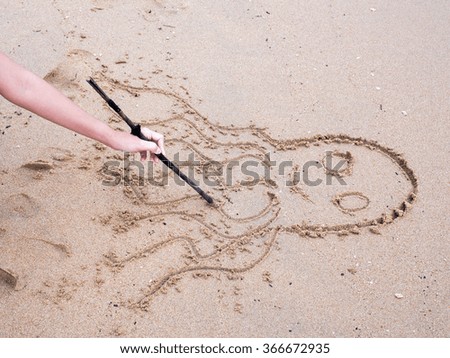 Sand writing with octopus picture