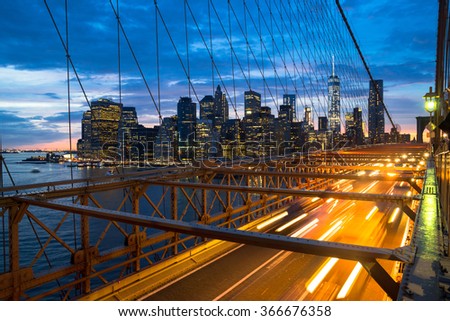 The Brooklyn Bridge and skyline of New York City at sunset