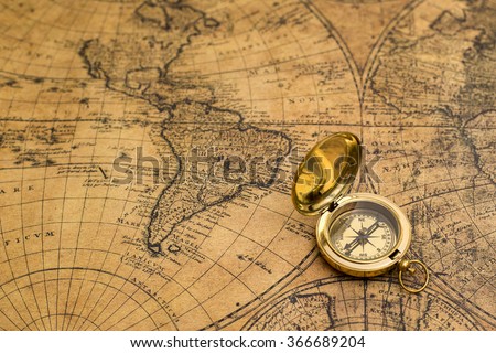 old compass on vintage map Royalty-Free Stock Photo #366689204