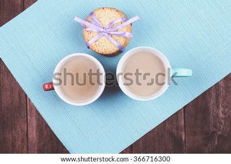 Two cups of coffee on the table. Morning coffee for two with cookies on the Valentines Day.