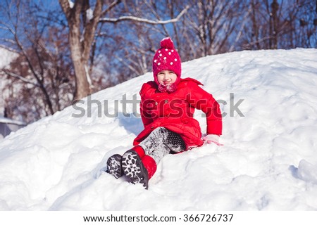 Winter photo of the girl on a snowy mountain