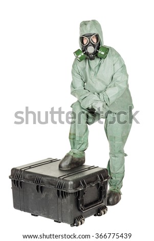 Man with protective mask and protective clothes prepares equipment for work. portrait isolated over white studio background.