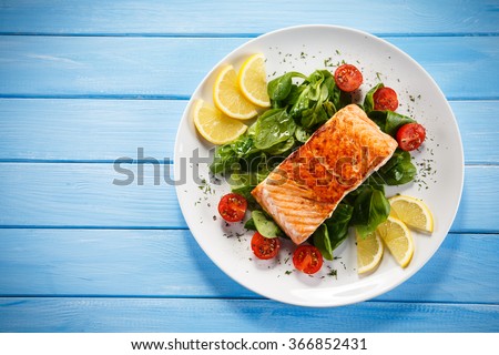 Grilled salmon and vegetables  Royalty-Free Stock Photo #366852431