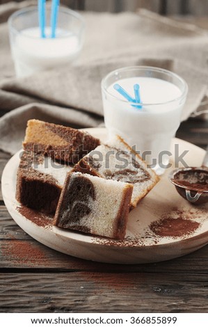 Sweet homemade marble cake with milk, selective focus