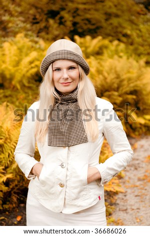 Picture of a young beautiful girl in an autumn park