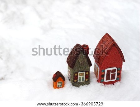 toy houses on white snow