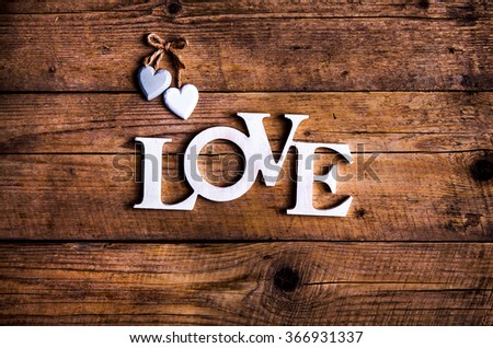 Word ''love'' on a old wood planks. St. Valentine's Day