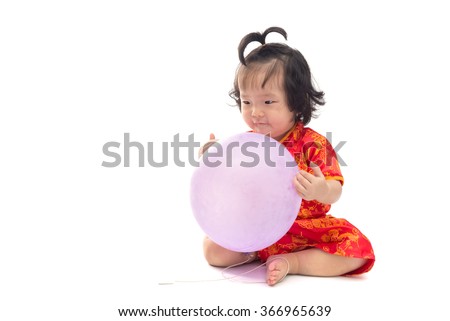 Cute Asian baby girl in traditional Chinese suit Isolated on white background, Chinese New Year Concept
