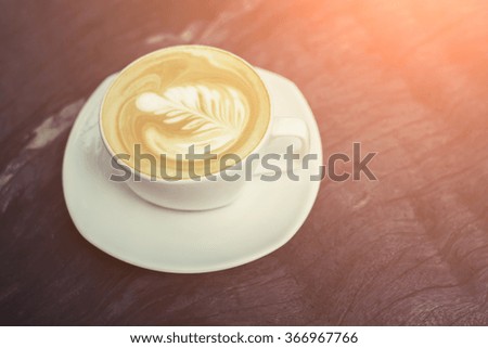 white cups of Cappuccino coffee with tree shaped milk foam. 