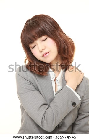 Japanese businesswoman suffers from neck ache