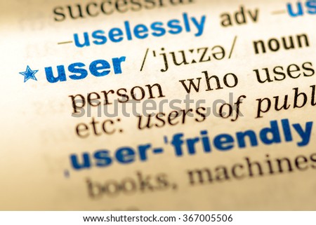 Close-up of word in English dictionary. User, definition and transcription