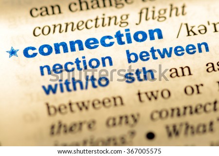 Close-up of word in English dictionary. Connection, definition and transcription