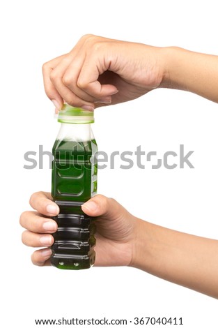 hand open green colored drinks in bottle isolated on white background