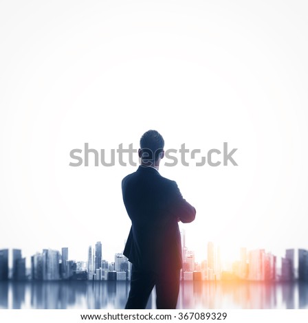 Buesinessman wearing classic suit and looking cityscape. Square