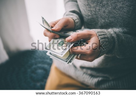 Hands counting us dollar bills. Toned picture Royalty-Free Stock Photo #367090163