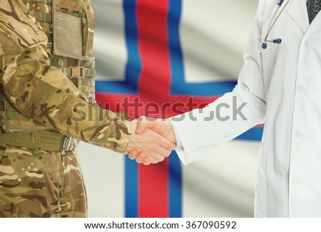 Soldier in uniform and doctor shaking hands with national flag on background - Faroe Islands