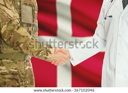 Soldier in uniform and doctor shaking hands with national flag on background - Denmark