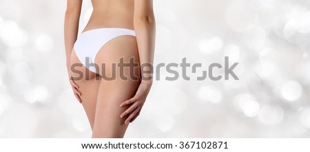 buttocks woman isolated on blurred lights background Royalty-Free Stock Photo #367102871